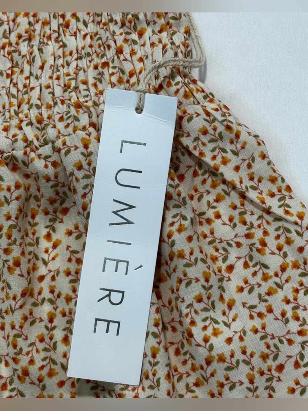 Lumiere long sleeve feminine Floral Print Smocked Peplum Top. 
Size: Small - Picture 8 of 11